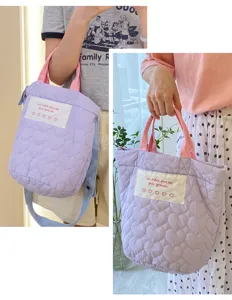 Purple quilted crossbody tote bag with pink handles, chic heart pattern fabric handbag for women.