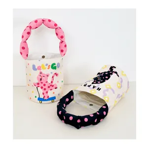 Detailed view of the cute canvas bucket bag featuring bubble padded handle and funny cat print.