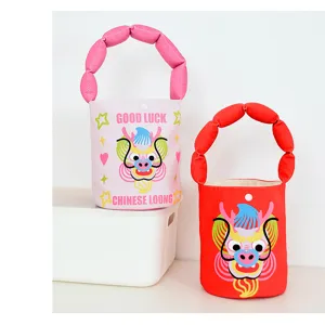 Cute cartoon dragon bucket bag with padded handle, festive New Year shoulder handbag.
