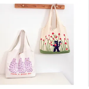 Cute polka dot cat print canvas tote bag, large capacity shoulder bag for daily casual use.