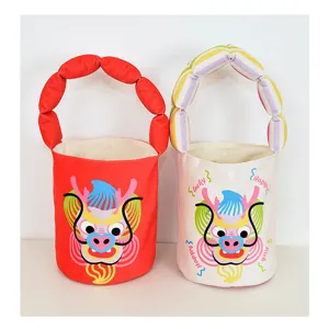 Cute cartoon dragon bucket bag with padded handle, festive canvas handbag for kids and women.