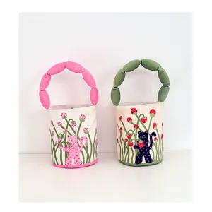Canvas bucket bag featuring a unique puffy stuffed handle and cute polka dot cat prints.