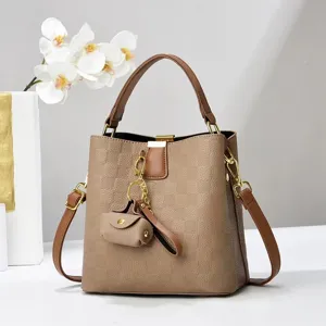 Stylish brown checkered bucket bag with top handle and shoulder strap for women daily use.