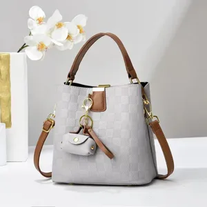 Chic grey checkered bucket bag with brown handle, versatile stylish shoulder crossbody bag.