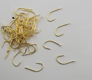 Gold fishing hooks with barbs, bulk and individual display, ideal for freshwater angling.