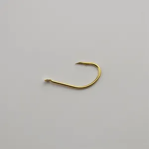 Gold fishing hook detail shot, single barb metal hook for fresh and saltwater angling.