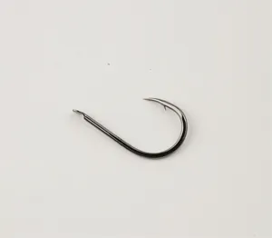 Carbon steel barbed fishing hook detail close up view, durable and sharp design for fishing.