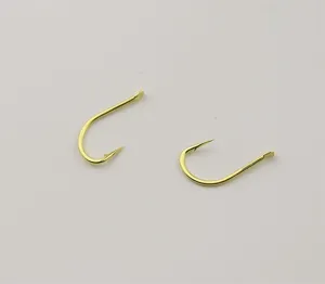 Detail view of gold barbed Izu fishing hooks, sharp hook point and flat eye for fishing.