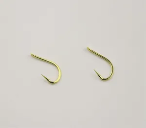 Gold barbed fishing hooks detail view, durable metal material, ideal for freshwater and saltwater fishing.