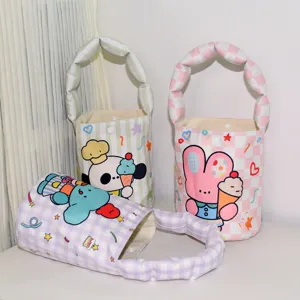 Cute cartoon canvas bucket bag featuring padded handle for kids daily outdoor use.