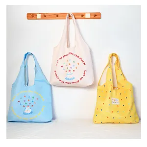 Casual canvas tote bag for women, large capacity shoulder bag with cute print and daily style.