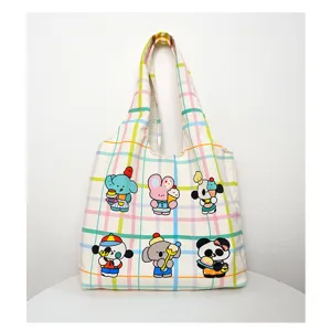 Canvas tote bag detail showcasing cute animal prints and pastel plaid pattern design.