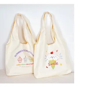Beige canvas tote bag with cute ice cream print, large capacity student shoulder bag detail.
