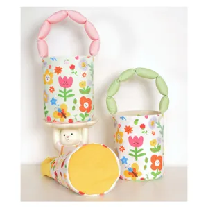 Cute floral canvas bucket bag with puffy handle, stylish women's casual crossbody handbag detail.