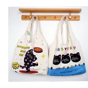 Canvas tote bag for women, large capacity shoulder bag with cute cat print, casual daily use.