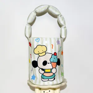 Detailed view of the cute cartoon printed bucket bag with padded handle for baby daily outing.
