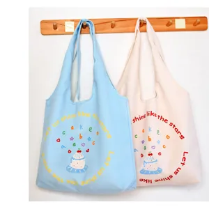 Casual large capacity canvas shoulder tote bag for women students cute daily commuting.