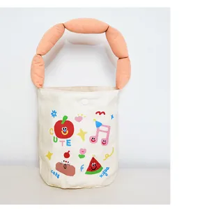 Close up of cute canvas bucket bag detail, puffy handle, trendy casual summer handbag design