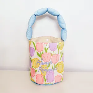 Chic tulip print bucket bag with puffy blue handle, stylish summer handbag for women daily work.