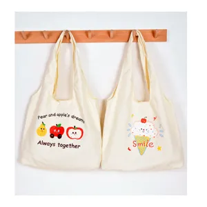 Beige canvas tote bag with cute fruit and ice cream print, large capacity for daily use.