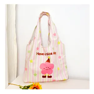 Pink striped canvas tote bag with cute cartoon flower print for daily casual use.