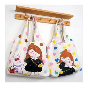 Detailed view of the casual canvas tote bag with cute cartoon prints and large capacity.