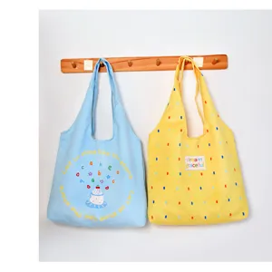 Canvas tote bag detail view, casual style with cute print and large capacity for daily use.