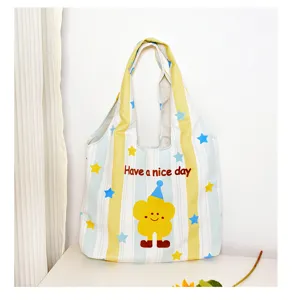 Canvas tote bag with yellow blue stripes and cute cartoon flower print for daily casual use.