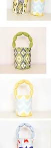 Canvas bucket handbag with unique bubble handle and ethnic geometric print design.
