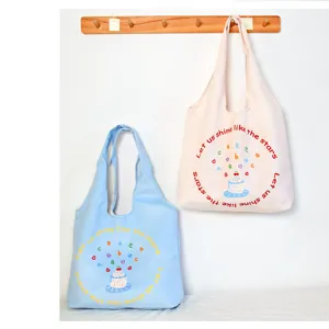 Detail view of the cute canvas tote bag featuring a charming graphic and spacious capacity.