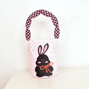 Cute pink polka dot bucket bag with black checkered padded handle and sweet rabbit print.