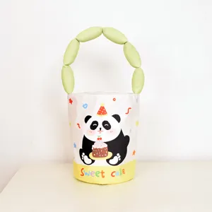 Cute cartoon panda cake print bucket bag with padded green handle, stylish and sweet tote.
