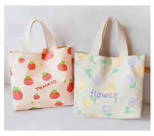 Canvas tote bag with cute tomato and flower print, portable bento handbag for daily use.