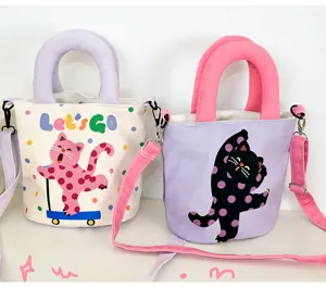Cute polka dot cat canvas bucket bag with top handle and adjustable crossbody strap