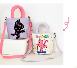 Details of the cute polka dot cat canvas bucket bag, fashionable shoulder and handbag style.