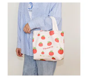 Canvas tote bag with cute tomato print and letter decoration, perfect for daily casual use.