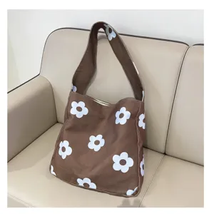 Brown floral canvas shoulder bag for women, retro underarm tote bag with large capacity.