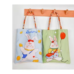 Cute canvas tote bag with cartoon rabbit and lemon print, lightweight small handbag.