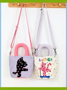 Main image of a cute polka dot cat print canvas crossbody bucket bag with top handle for women.
