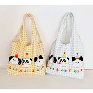 Cute plaid canvas tote bag detail, featuring adorable animal prints and sweet style design.