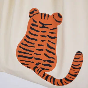 Canvas bag tiger pattern detail shot, cute cartoon design for casual shopping use.