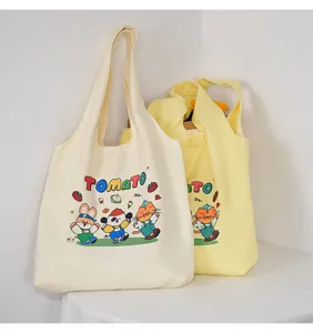 Canvas tote bag with cute tomato cartoon print, casual shoulder bag for daily use and school.