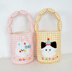 Detailed view of cute plaid canvas tote bags with bubble handles and adorable cartoon animal prints.