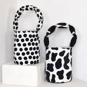 Canvas bucket handbag with knotted handle, cute polka dot and cow print styles for women.