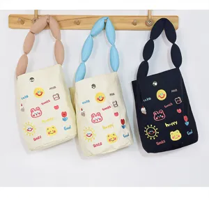 Canvas bucket bag with bubble handle cute cartoon embroidery lock closure handbag detail view