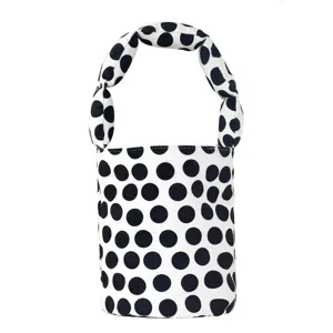 Canvas bucket handbag with black and white polka dots, trendy knotted handle design for women.