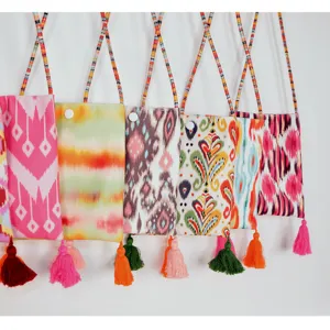 Ethnic style canvas phone bag with beaded strap and tassel detail for women.