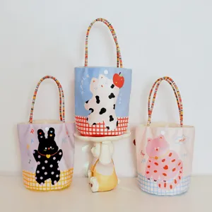 Cute cartoon animal print canvas tote bag with colorful beaded handle for casual daily use.