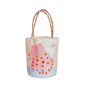 Cute pink polka-dot cat canvas tote bag with colorful braided handles for daily use.