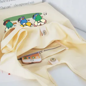 Canvas tote shoulder bag for women, large capacity vest style casual handbag with cute cartoon print.